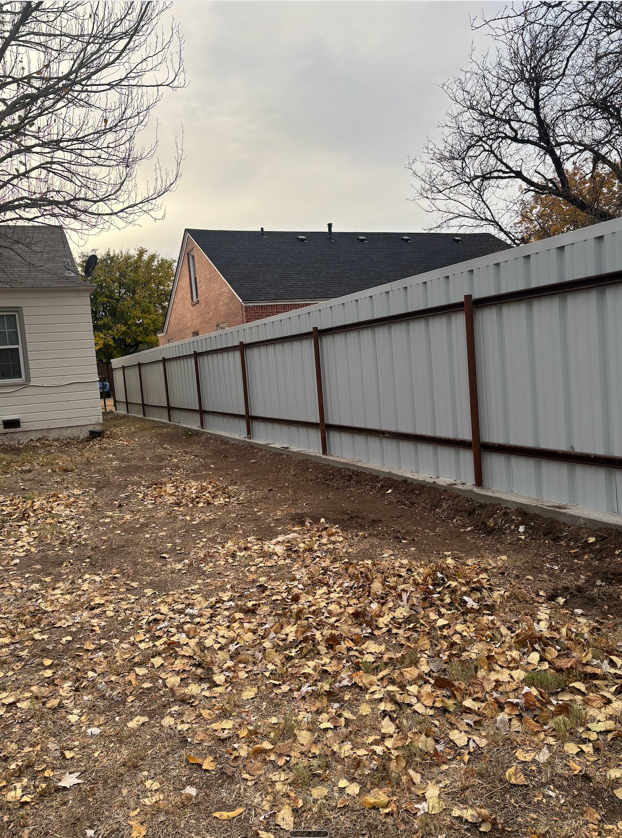Sheet metal fence with iron frame, residential install