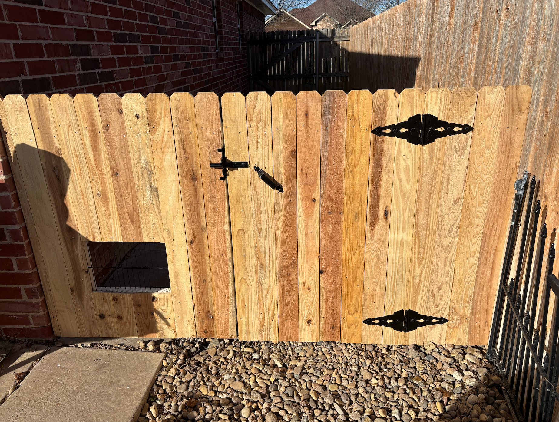 Wood privacy fence gate with custom dog door