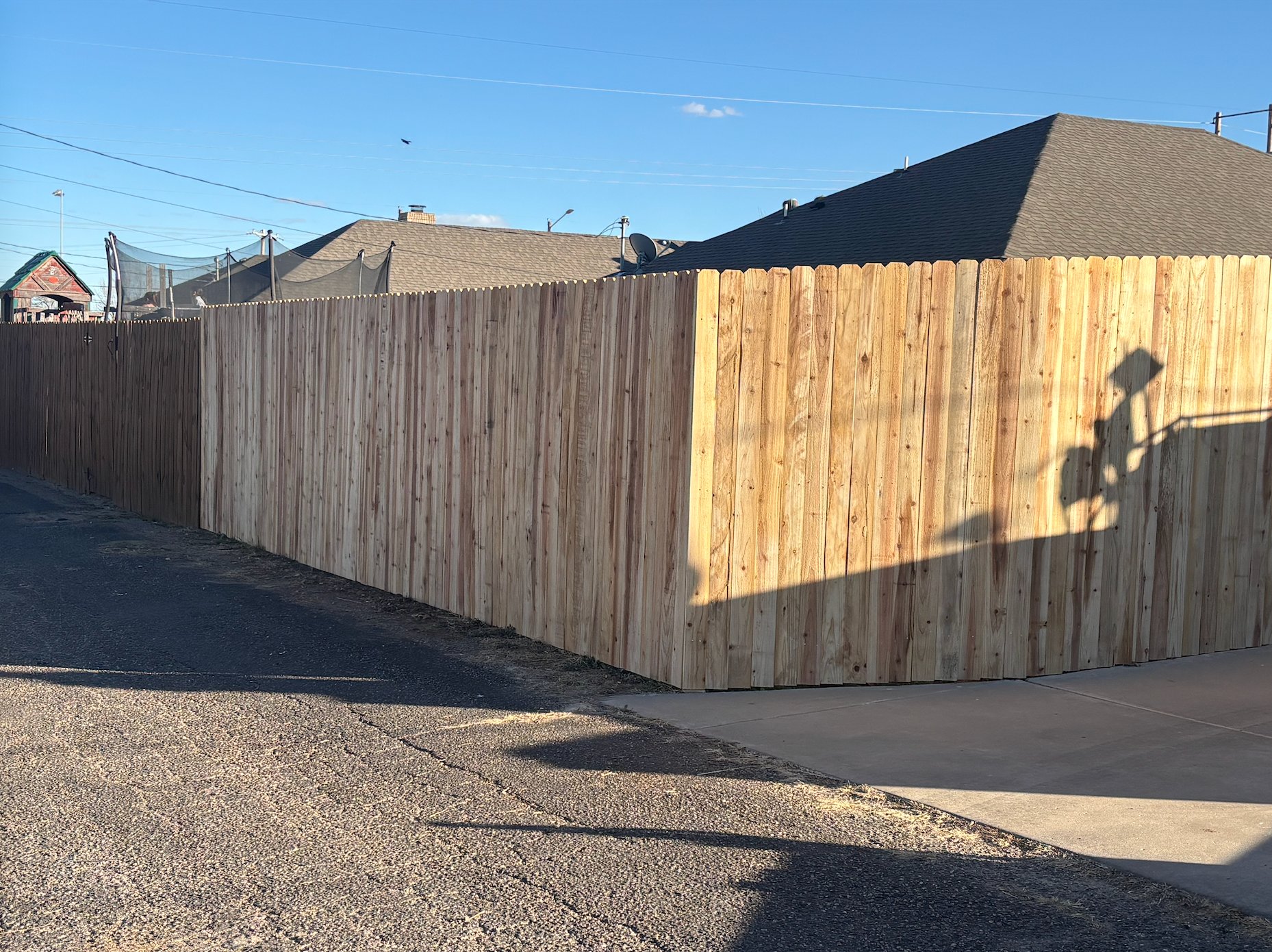 Cedar wood privacy fence alley view in Canyon, TX