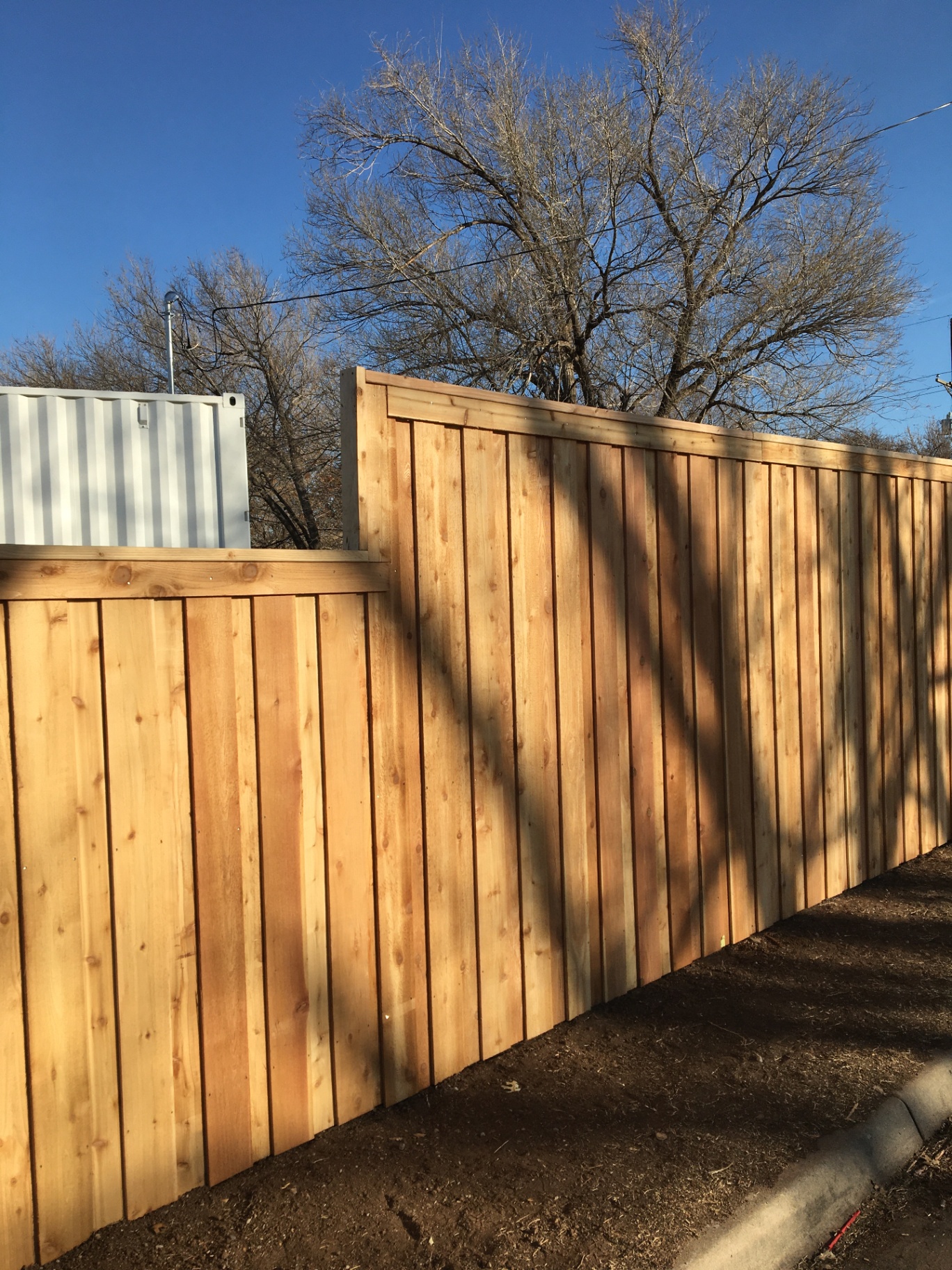 Cedar board-on-board wood privacy fence install in Amarillo, TX